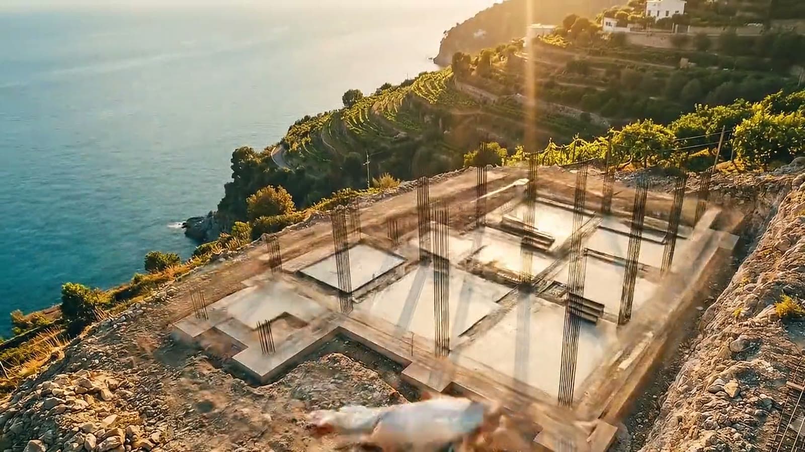 Brand imagery — foundations being laid, seen from above.