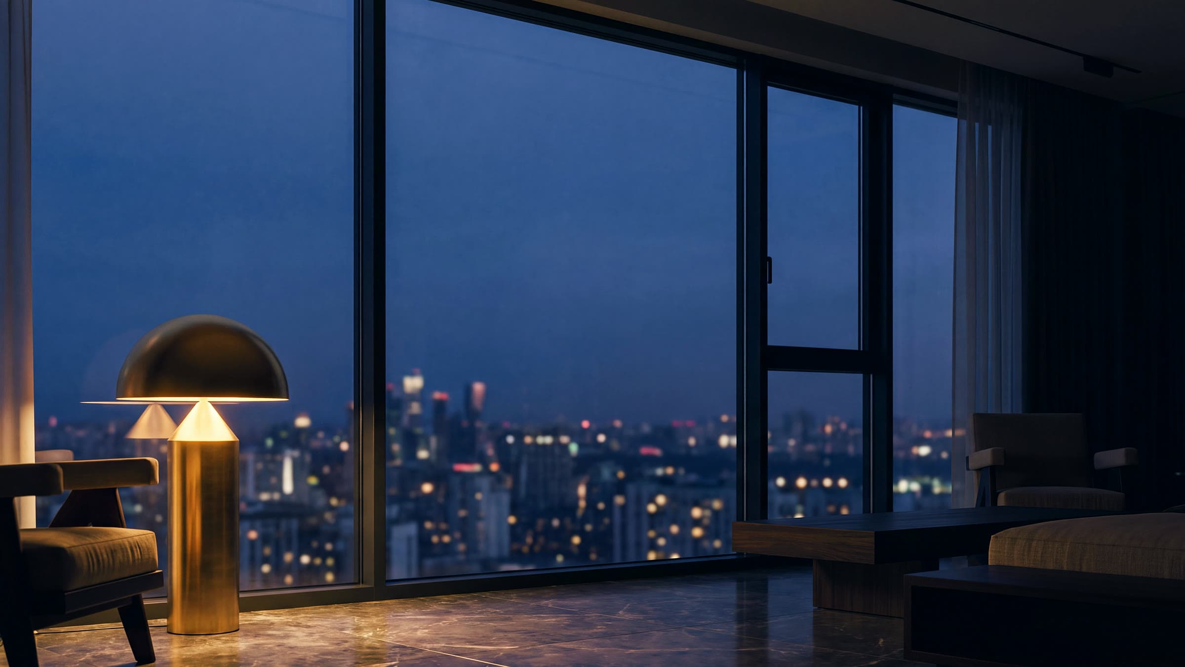 Brand imagery — a finished interior at dusk, the city beyond the glass.