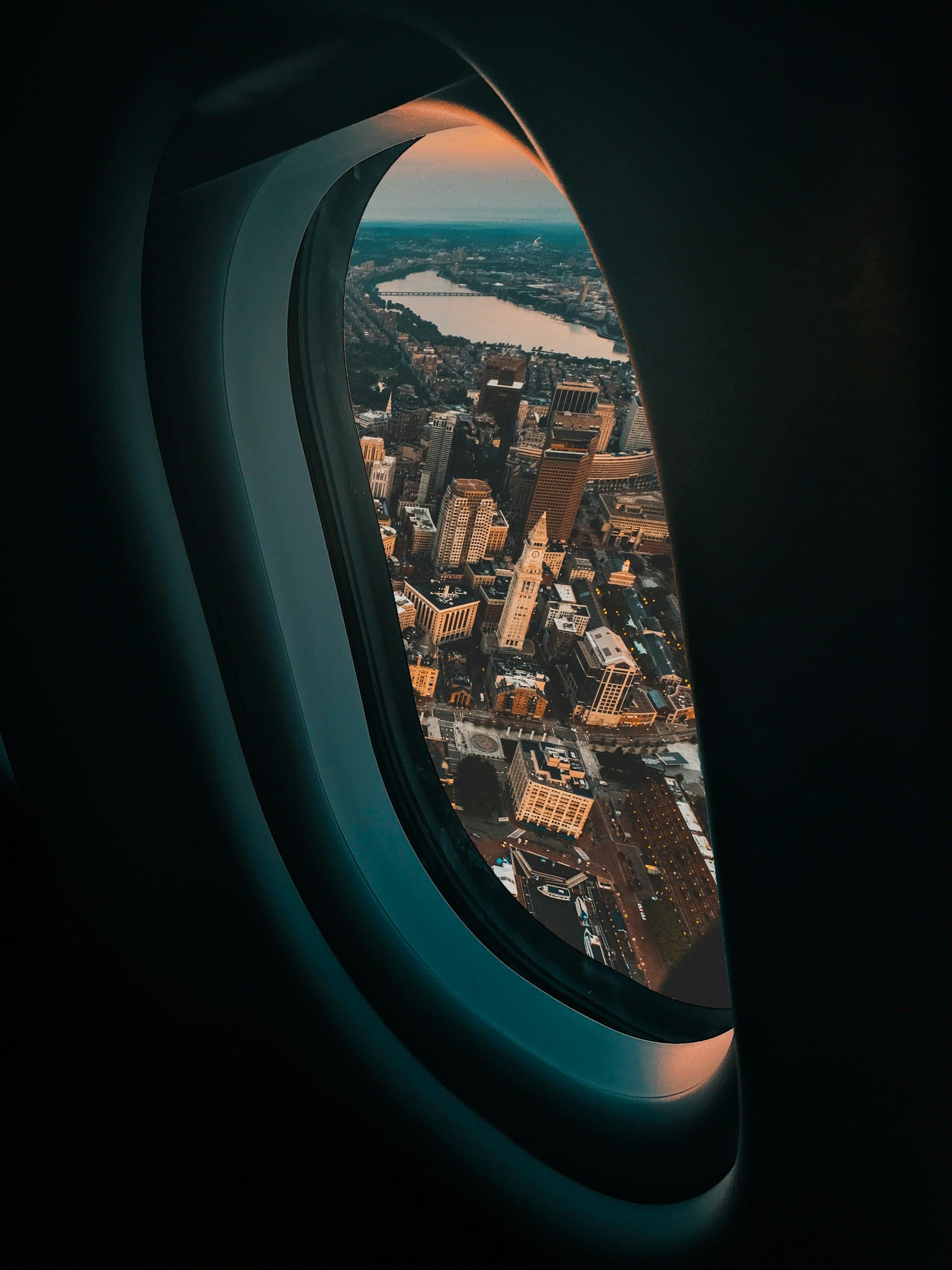 A city seen from an aircraft window — the view of an investor living abroad.