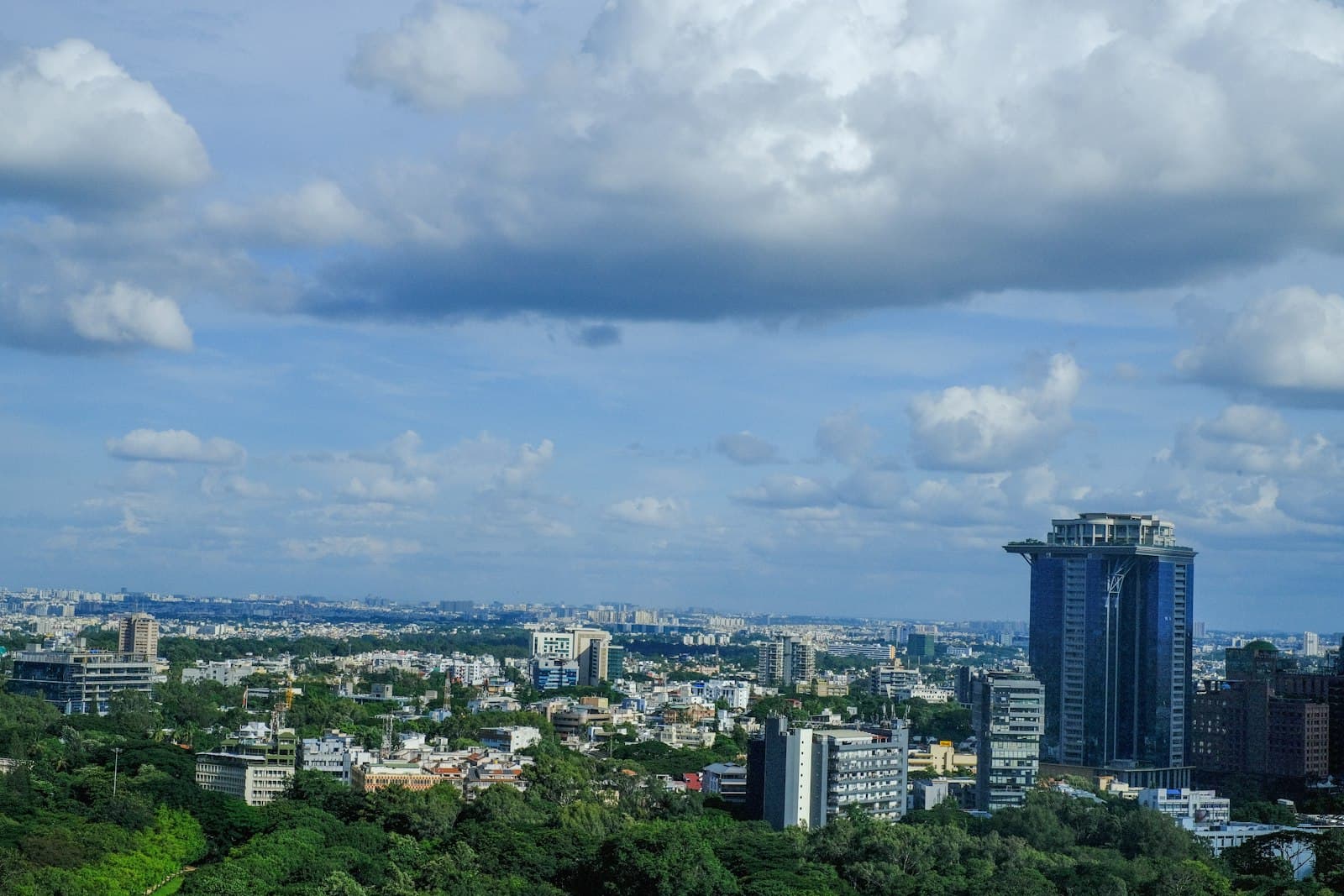 Bengaluru's business district towers, photographed under monsoon cloud