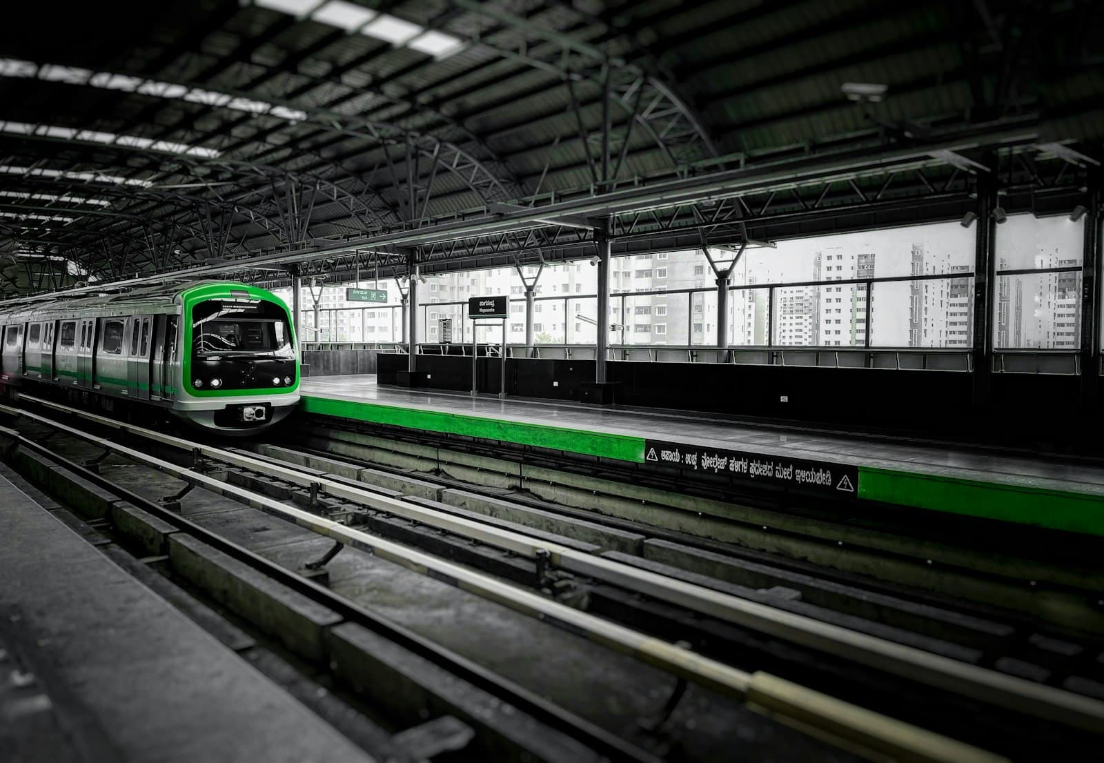 A Namma Metro train pulling into a Bengaluru station — photograph