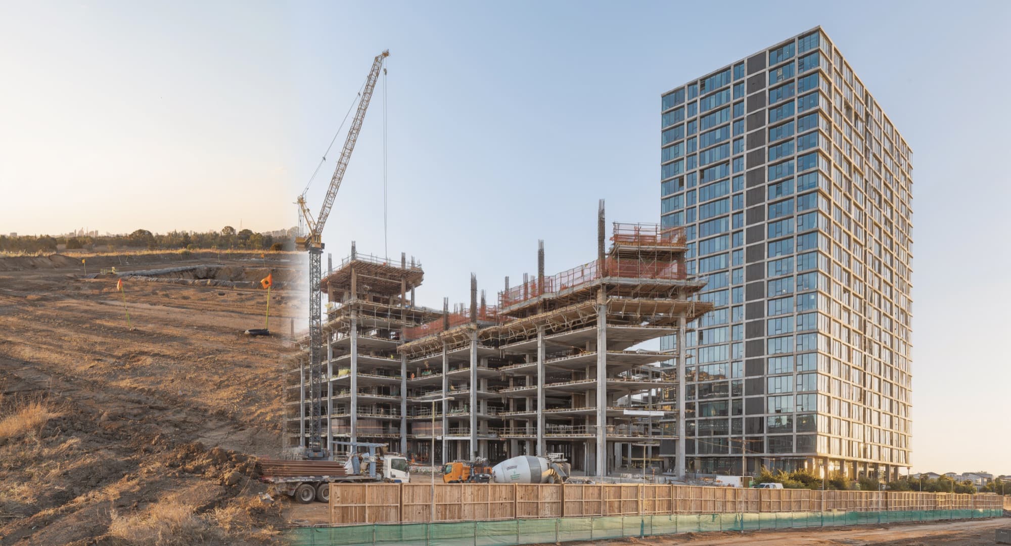 Brand imagery — a crane over a rising structure beside a finished tower, not a Catch9 project.